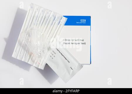 Covid-19 Self-test Rapid antigen test kit in box for home use., showing the contents. swabs and tester. Stock Photo