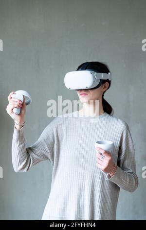 Woman using Virtual Reality Oculus Headset. Stock Photo