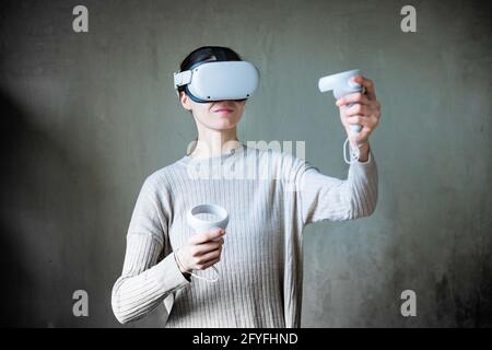 Woman using Virtual Reality Oculus Headset. Stock Photo