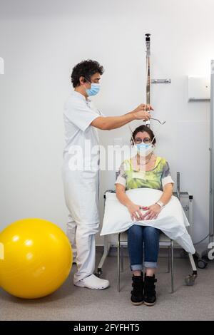 Lumbar traction session performed by a physiotherapist, Limoges hospital, France. Stock Photo