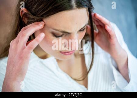 Woman suffering from headache. Stock Photo