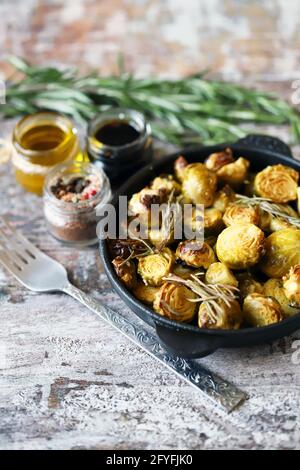 Roasted Brussels sprouts in a cast iron skillet. Stock Photo