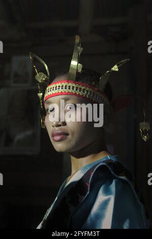 Portrait of a woman in traditional clothing as she is waiting to participate in a show of traditional game and 'caci' (Flores Island's traditional whip fight, martial art) in Liang Ndara village, Mbeliling, West Manggarai, Flores, East Nusa Tenggara, Indonesia. Stock Photo