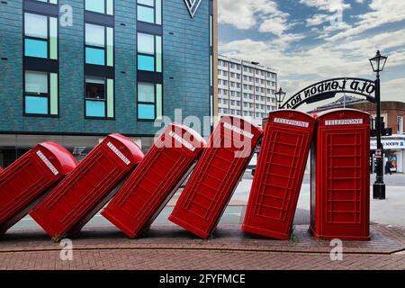 Out of Order by David Mach - a street sculpture of red telephone boxes in Old London Road, Kingston upon Thames, Greater London, England, UK Stock Photo