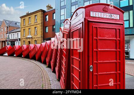 Out of Order by David Mach - a street sculpture of red telephone boxes in Old London Road, Kingston upon Thames, Greater London, England, UK Stock Photo