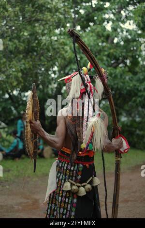 Back portrait of a warrior of 'caci' (Flores Island's traditional whip fight, martial art) during a performance in Liang Ndara village, Mbeliling, West Manggarai, Flores, East Nusa Tenggara, Indonesia. Stock Photo