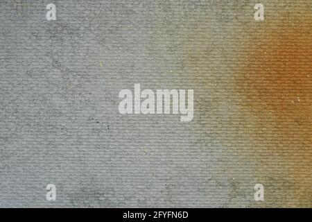 The textured surface of a smooth slate sheet with a red rust stain. Background textures. Stock Photo