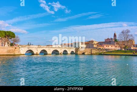 Rimini with the Bridge of Tiberius, Italy. Italian landscape with old town and river, panoramic view Stock Photo