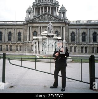 BELFAST, UNITED KINGDOM - SEPTEMBER 1978. RUC, Royal Ulster Constabulary, Policeman on Patrol in City Centre during The Troubles, Northern Ireland, 1970s Stock Photo