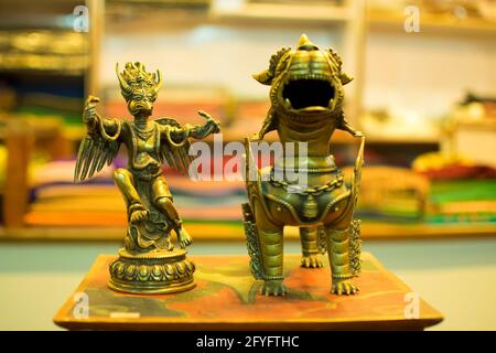 Chinese emperor with a snake and dragon by side, toys on display at local market , Leh, Ladakh, India. These toys are popular for Ladakhi people. Stock Photo