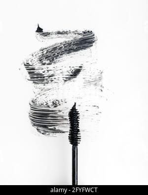 Black mascara on a white background. Stock Photo