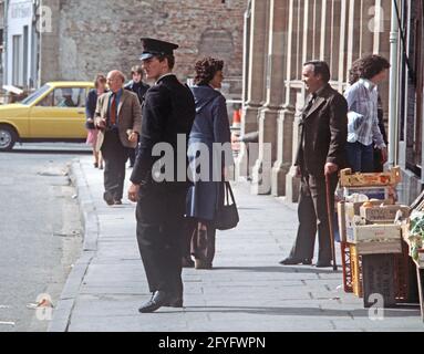BELFAST, UNITED KINGDOM - SEPTEMBER 1978. RUC, Royal Ulster Constabulary, policeman on Patrol of Belfast Streets during The Troubles, Northern Ireland, 1970s Stock Photo