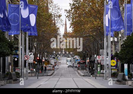 Melbourne, Australia. 28th May, 2021. An empty street is seen amid the COVID-19 pandemic in Melbourne, Australia, on May 28, 2021. Australia has seen the COVID-19 vaccine doses administered surpass 4 million, almost two months after the government's initial deadline for the target. Credit: Xue Bai/Xinhua/Alamy Live News Stock Photo