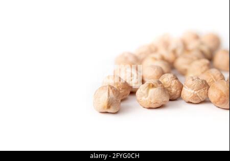 Isolated dry chickpeas. Versatile superfood legume, high in protein and fiber. Known as garbanzo bean, bengal gram or Cicer arietinum. Used for hummus Stock Photo