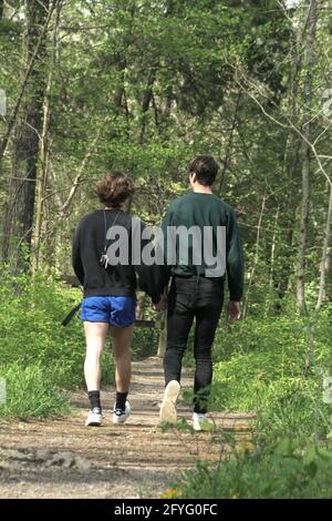 Young gay couple walking on a trail in the U.S.A. Stock Photo