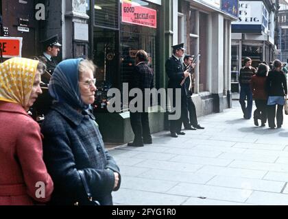 BELFAST, UNITED KINGDOM - SEPTEMBER 1978. RUC, Royal Ulster Constabulary, Policeman on Patrol in City Centre during The Troubles, Northern Ireland, 1970s Stock Photo