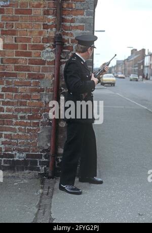 BELFAST, UNITED KINGDOM - SEPTEMBER 1978. RUC, Royal Ulster Constabulary, policeman on Patrol of East Belfast Streets during The Troubles, Northern Ireland, 1970s Stock Photo