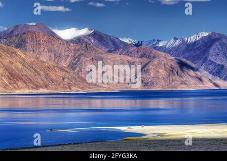 Mountain reflection on Pangong tso (Lake). It is huge lake in United territory of Ladakh,India at Indo China border. Stock Photo