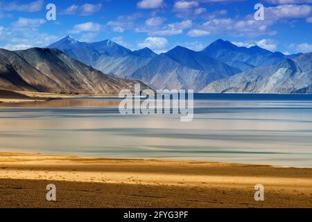 Mountains and Pangong tso (Lake). It is huge lake in united territory of Ladakh, India, at India China border extends Tibet. Stock Photo