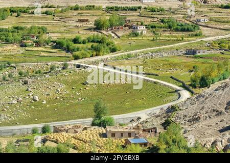 Curvy road of Leh with green land view from top,  Ladakh, Jammu and Kashmir, India Stock Photo