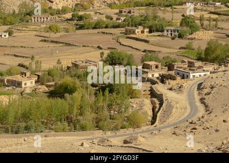 Curvy road of Leh with green land view from top, Ladakh, Union territory, India. View from distance of Himalayan mountains. Stock Photo