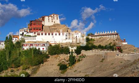 Thiksay monastery with view of Himalayan mountians and blue sky with white clouds  in background,Ladakh,Jammu and Kashmir, India Stock Photo