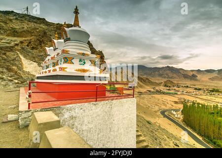 Thiksay monastery with view of Himalayan mountians and blue sky with white clouds in background,Ladakh,Jammu and Kashmir, India Stock Photo