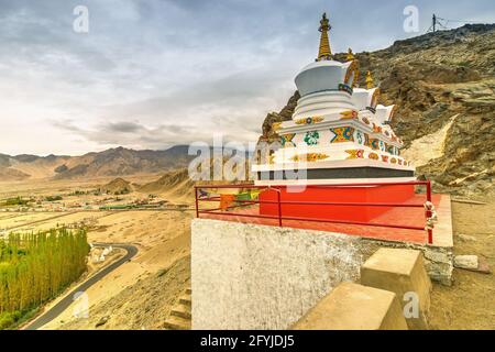 Thiksay monastery with view of Himalayan mountians and blue sky with white clouds in background,Ladakh,Jammu and Kashmir, India Stock Photo