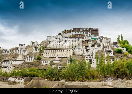 Thiksay monastery with view of Himalayan mountians and blue sky in the background - famous Buddhist temple in,Leh, Ladakh, Jammu and Kashmir, India Stock Photo