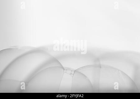 Many soap bubbles piled on white background in details Stock Photo