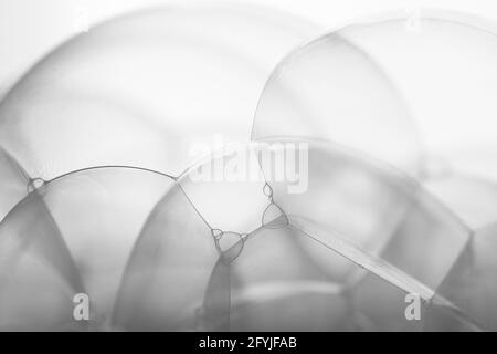 Many soap bubbles piled on white background in details Stock Photo