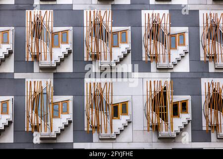 A photograph of the members block of the Scottish Parliament. There are geometric windows called thinking pods or contemplation pods in rows Stock Photo