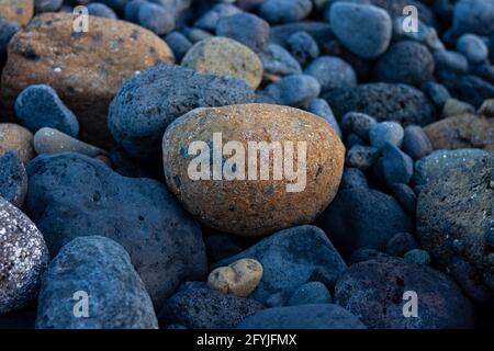 Blue and orange volcanic beach rocks, Santa Cruz de La Palma, Canary Islands, Spain. Stock Photo