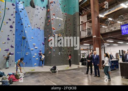 Alexandria, United States. 28th May, 2021. President Joe Biden and Virginia Governor Ralph Northam watch climbers before they deliver remarks at Sportrock Climbing Center to recognize the progress Virginia has made in the fight against COVID-19, in Alexandria, Virginia, on Friday, May 28, 2021. Photo by Chris Kleponis/UPI Credit: UPI/Alamy Live News Stock Photo