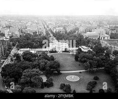 Aerial photo of Washington, D.C. and the North Front and South Rear of the White House taken from Lafayette Park in President's Park. Also included in the photograph are the Ellipse, Washington Monument, Jefferson Memorial, Executive Office Building, and the United States Department of the Treasury building. Stock Photo