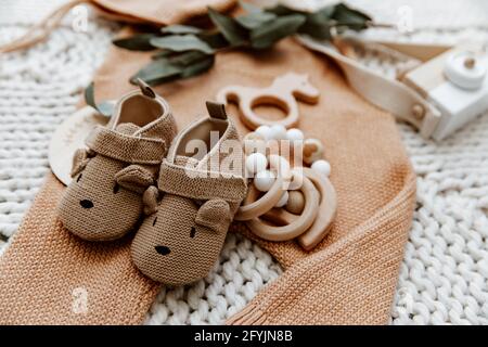 A pair of booties, toys and accessories for a newborn baby Stock Photo