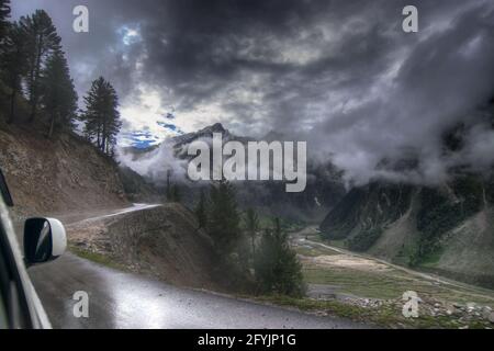 storm clouds over mountains of ladakh, Leh Srinagar Highway, green valley sccenary, Jammu and Kashmir, India. Rainy weather , stock image. Stock Photo