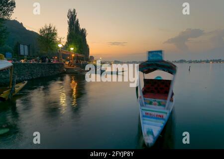 Srinagar, Jammu and Kashmir, India - 31st August 2014 : A Houseboat is floating on water after sunset in the Dal lake, Srinagar, Jammu and Kashmir, In Stock Photo