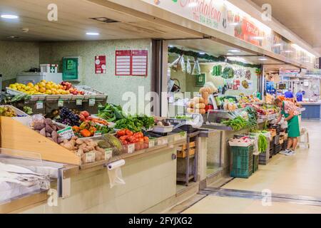 FARO, PORTUGAL - OCTOBER 5, 2017: Fruit and vegetable stalls at Faro Municipal Market Mercado Municipal de Faro in Faro, Portugal. Stock Photo