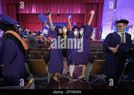 New York, USA. 27th May, 2021. Nurses from the class of 2021 celebrate their graduation from Hunter College Nursing school after attending the first in-person ceremony since the fall of 2019, in New York, NY, May 27, 2021. The ceremony was also held virtually for those not able to participate, a limited number of guest were allowed to attend, and proof of a negative COVID-19 test taken within 72 hours prior to graduation was required. (Photo by Anthony Behar/Sipa USA) Credit: Sipa USA/Alamy Live News Stock Photo