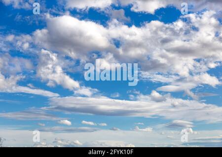 white-gray clouds fly across the blue sky. Texture of clouds and sky Stock Photo