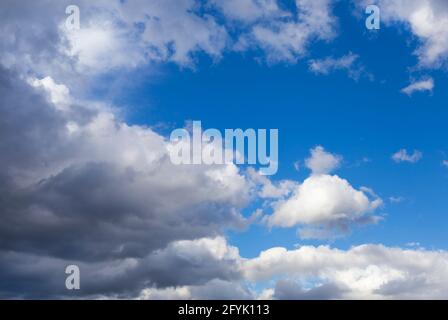 white-gray clouds fly across the blue sky. Texture of clouds and sky Stock Photo