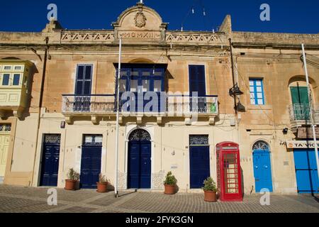 MARSAXLOKK, MALTA - 03 JAN, 2020: Classic red British telephone box at the traditional fishing village of Marsaxlokk Stock Photo