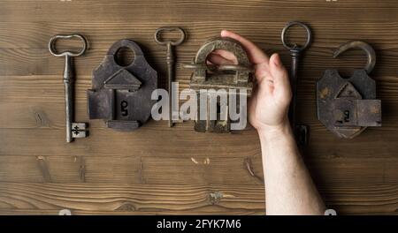 Vintage padlock on hand Stock Photo