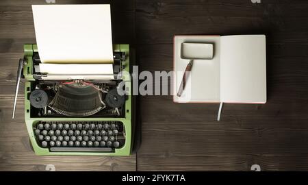 vintage typewriter and magnifier on handbook Stock Photo