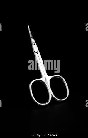 metal manicure scissors isolated on black Stock Photo