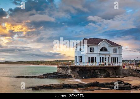 Sunset at the Arcadia, a historic cafe and former ballroom on the coast at Portrush, a small seaside resort town in County Antrim, Northern Ireland. Stock Photo