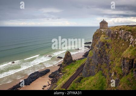 The Mussenden temple is perched on the cliffs overlooking Downhill Strand and located on the Causeway coastal route at Castlerock, County Londonderry. Stock Photo