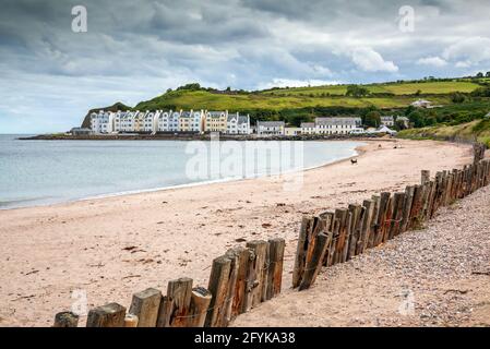 The beach and wooden breakwater at the picturesque village of Cushendun on the coast of County Antrim, Northern Ireland. Stock Photo