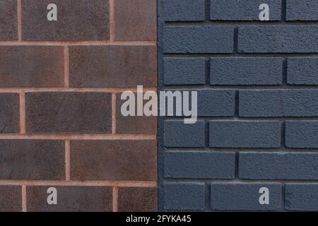 Close up of dark orange and black brick wall texture background connected together. Two walls connected together. Stock Photo